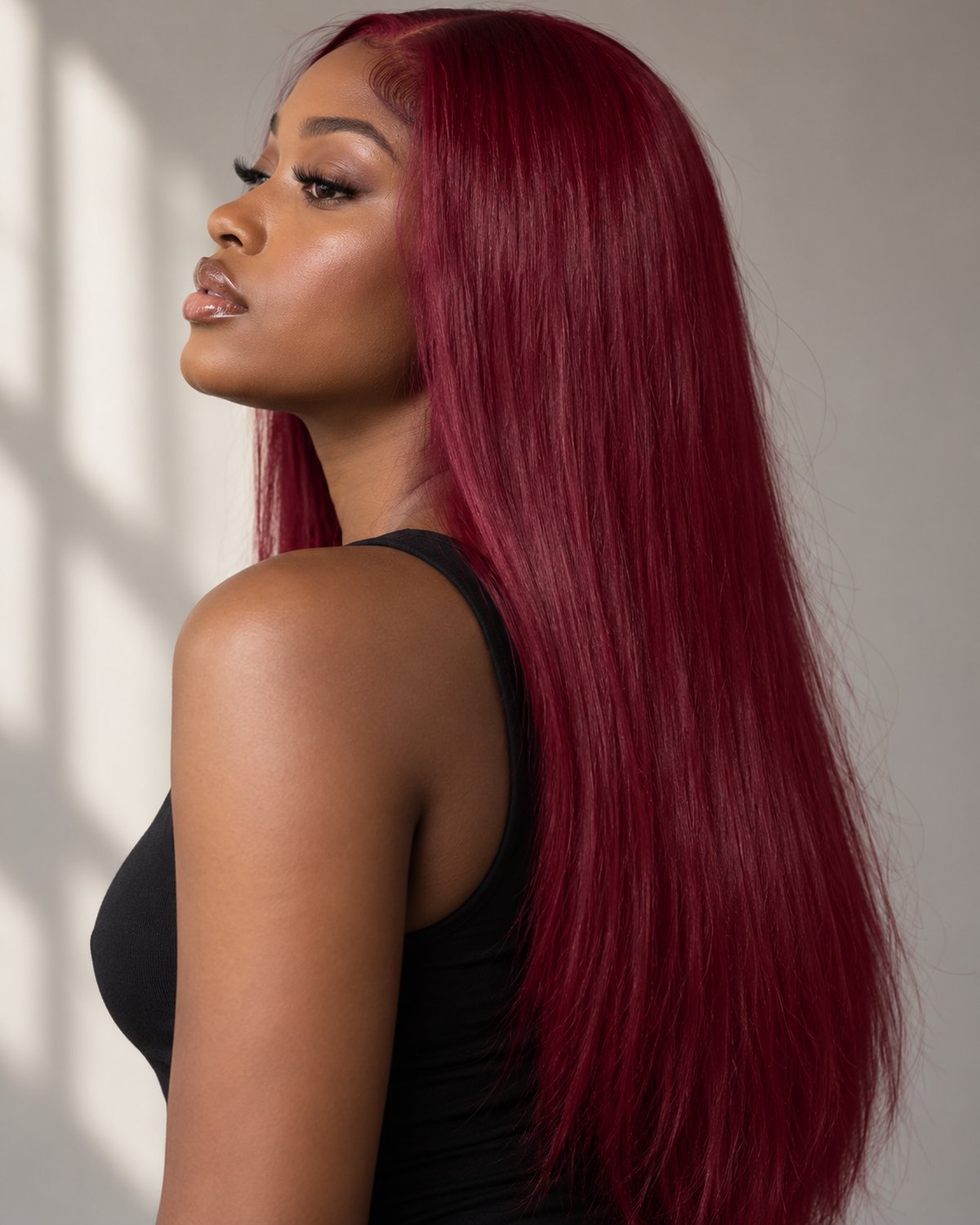Model wearing clip-in extensions in this shade family